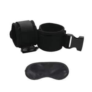 Black handcuffs and blindfold on white background.